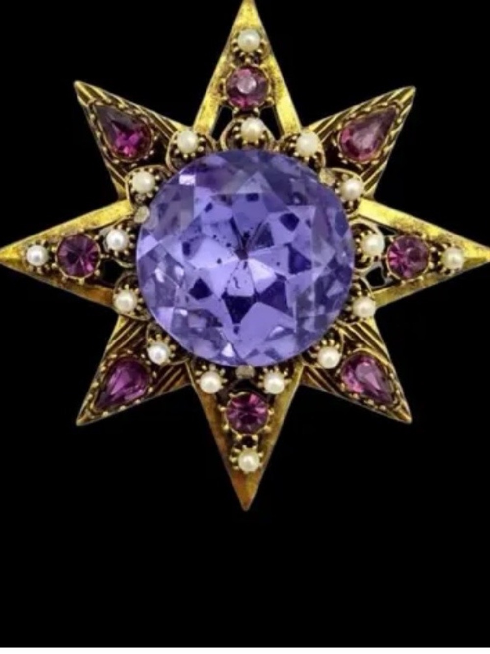 Gold-Tone Starburst Brooch with Purple Crystal Center